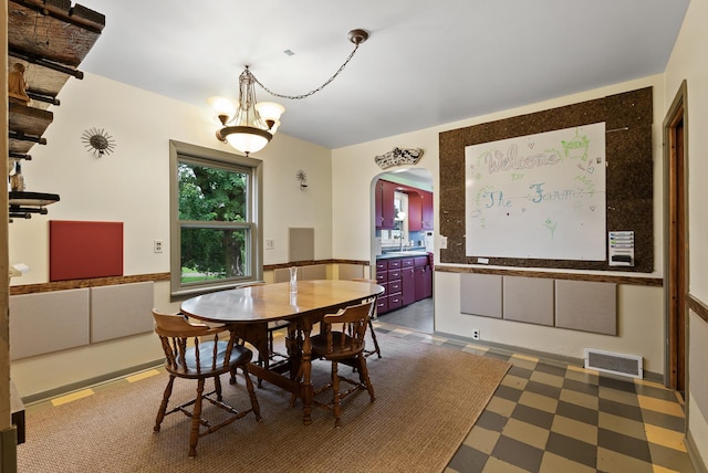 16985 Homestead Rd, Carver, MN 55315 - dining room with dark floors and arched walkways