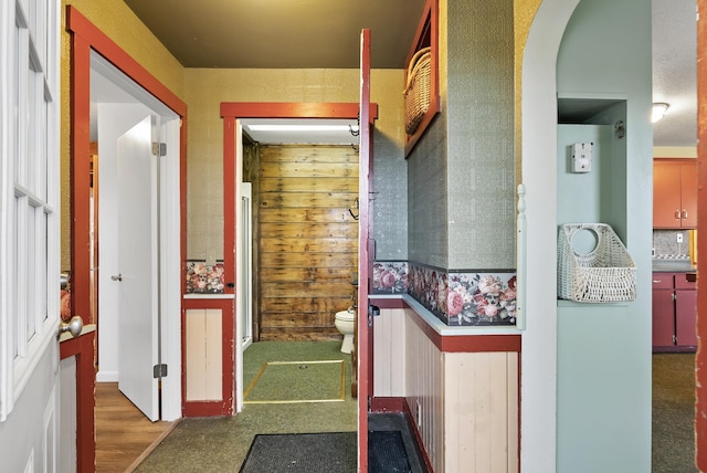 16985 Homestead Rd, Carver, MN 55315 - hallway featuring arched walkways and wood finished floors