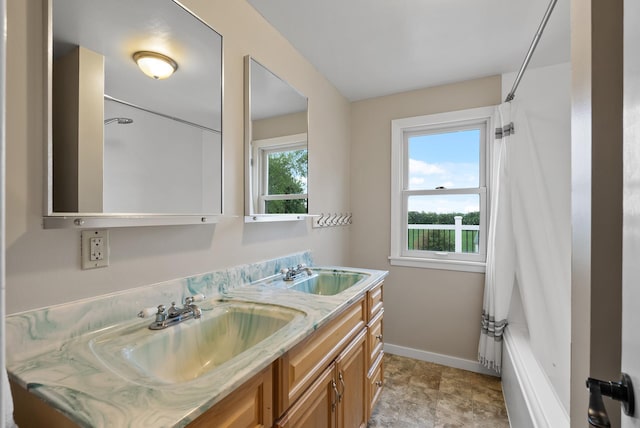 16985 Homestead Rd, Carver, MN 55315 - full bathroom featuring double vanity and shower / bath combo with shower curtain