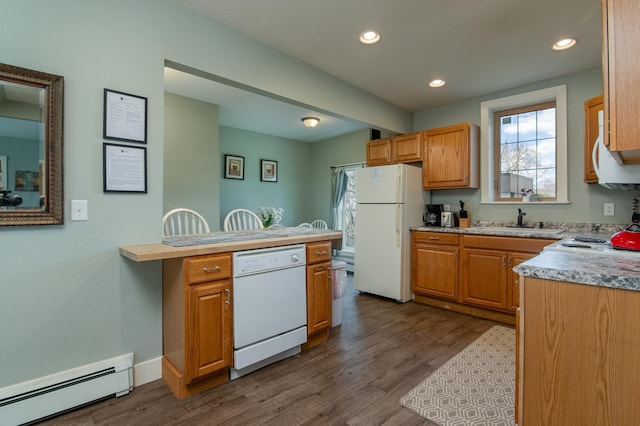 311 Prairie St, Lake City, MN 55041 - kitchen featuring baseboard heating, dark wood-style floors, a sink, and white appliances