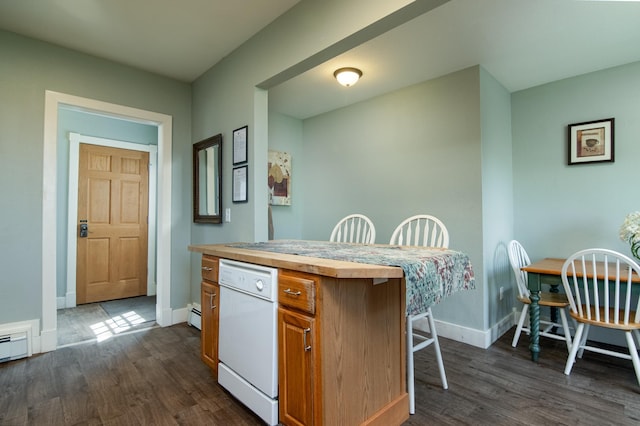311 Prairie St, Lake City, MN 55041 - kitchen featuring dark wood finished floors, baseboards, a kitchen breakfast bar, and butcher block countertops
