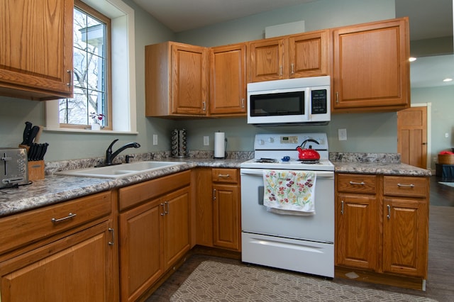 311 Prairie St, Lake City, MN 55041 - kitchen with a wealth of natural light, dark wood-style flooring, a sink, and white appliances