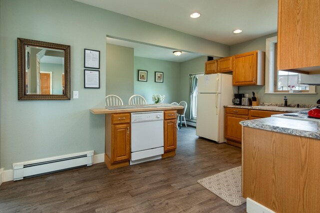 311 Prairie St, Lake City, MN 55041 - kitchen with light countertops, baseboard heating, dark wood-style flooring, and white appliances