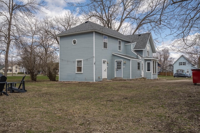 311 Prairie St, Lake City, MN 55041 - back of house with roof with shingles and a lawn