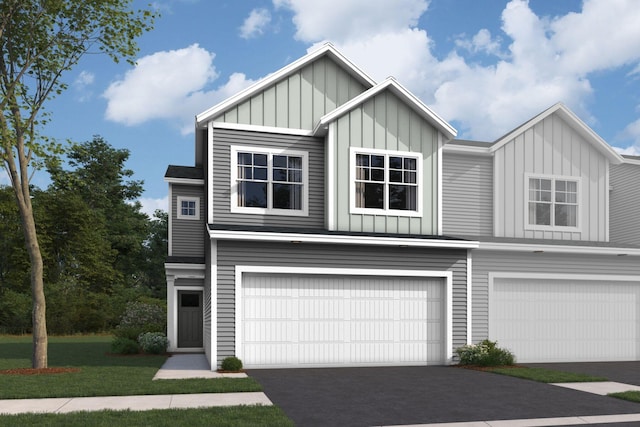 multi unit property with a garage, board and batten siding, a front lawn, and aphalt driveway