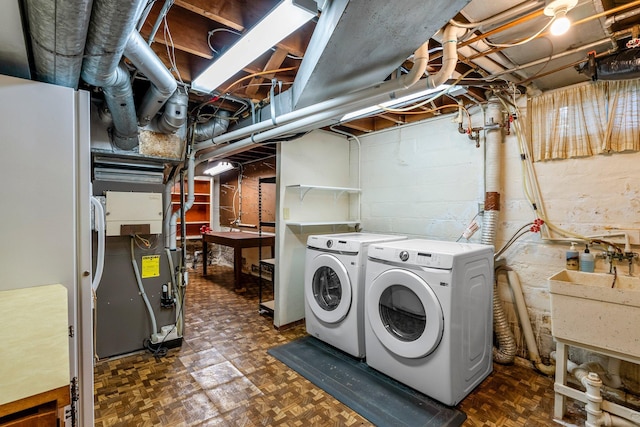 laundry area with independent washer and dryer