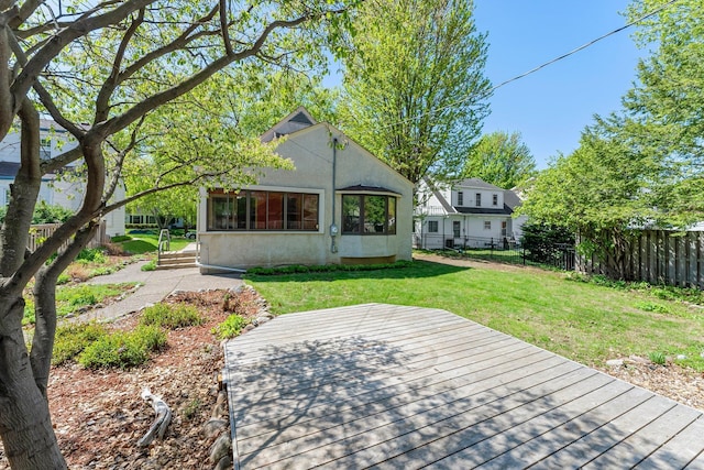 rear view of property with stucco siding