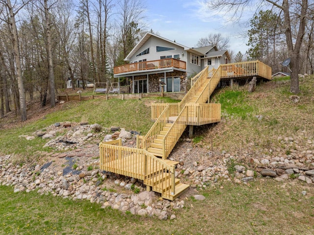 16227 Bay Dr, Pengilly, MN 55775 - back of house with stairway, a wooden deck, and stone siding