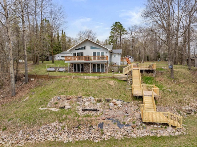 16227 Bay Dr, Pengilly, MN 55775 - back of house with stairs, a deck, a yard, and stone siding