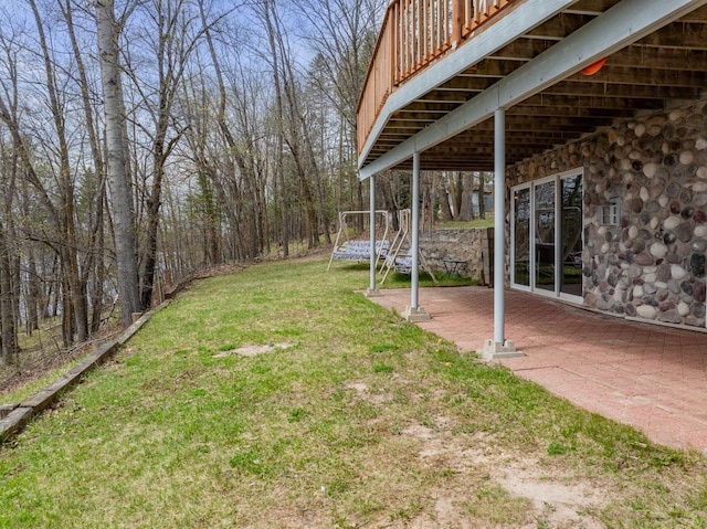 16227 Bay Dr, Pengilly, MN 55775 - view of green lawn featuring a patio and a wooden deck