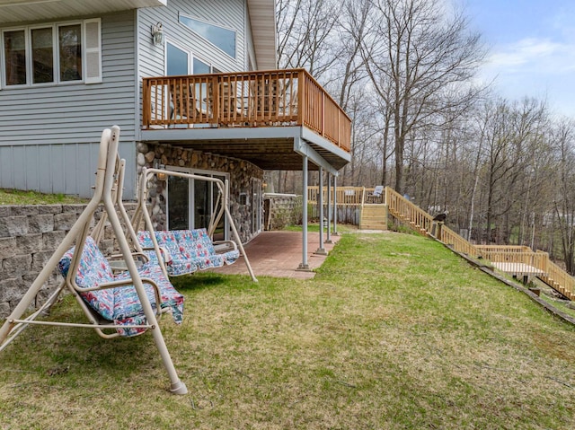 16227 Bay Dr, Pengilly, MN 55775 - view of green lawn featuring a patio area, stairway, and a wooden deck