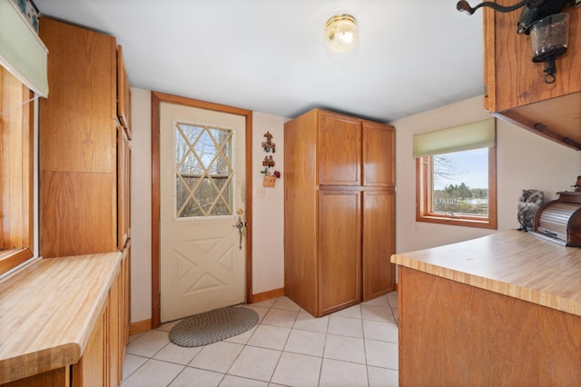 16227 Bay Dr, Pengilly, MN 55775 - interior space featuring healthy amount of natural light, light tile patterned floors, and baseboards