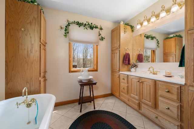 16227 Bay Dr, Pengilly, MN 55775 - bathroom featuring a freestanding bath, tile patterned flooring, baseboards, and vanity