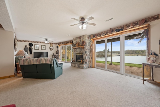16227 Bay Dr, Pengilly, MN 55775 - carpeted living room with ceiling fan, a textured ceiling, and a fireplace