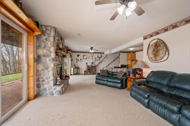 16227 Bay Dr, Pengilly, MN 55775 - carpeted living room with ceiling fan and a fireplace