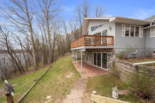 16227 Bay Dr, Pengilly, MN 55775 - back of house featuring a patio, a wooden deck, and a lawn
