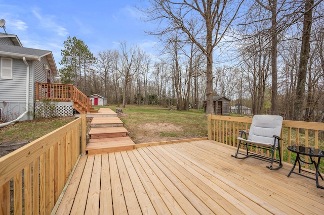16227 Bay Dr, Pengilly, MN 55775 - wooden deck with a storage unit, an outdoor structure, stairway, and a lawn
