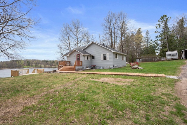 16227 Bay Dr, Pengilly, MN 55775 - view of front facade with a front lawn and a deck with water view