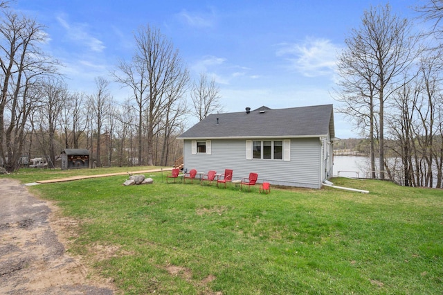 16227 Bay Dr, Pengilly, MN 55775 - view of side of home featuring a yard and a shingled roof