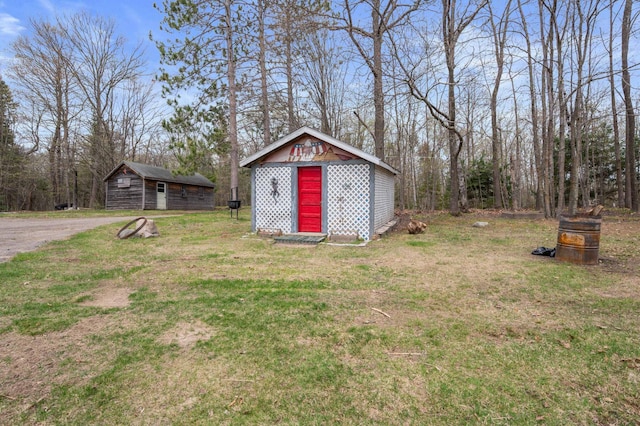 16227 Bay Dr, Pengilly, MN 55775 - view of grassy yard featuring an outbuilding and a storage shed