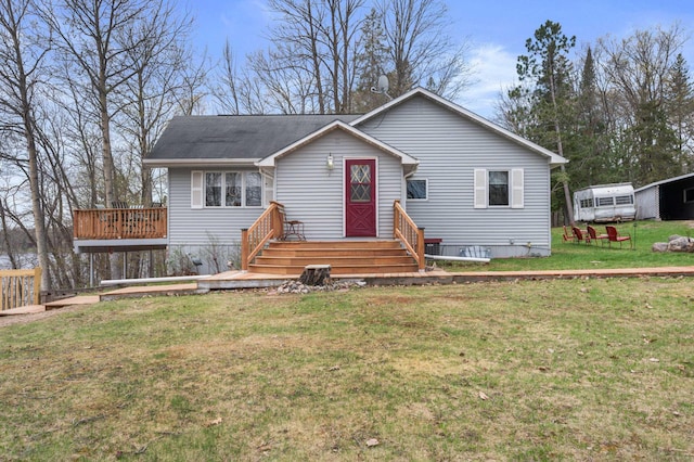 16227 Bay Dr, Pengilly, MN 55775 - view of front facade with a front yard and a wooden deck