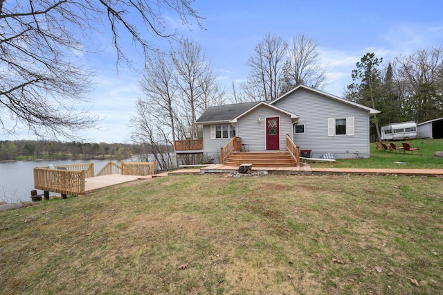 16227 Bay Dr, Pengilly, MN 55775 - view of front of property with a front lawn and a deck with water view