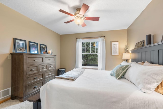 bedroom featuring a ceiling fan and visible vents