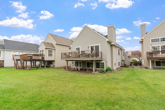 back of house with a lawn, central air condition unit, a chimney, and a deck