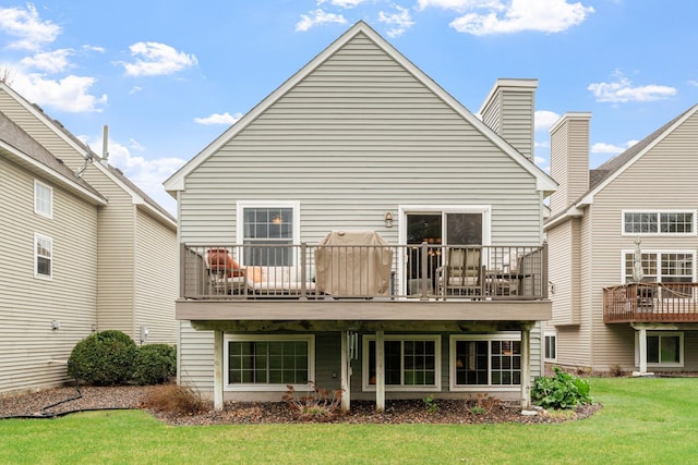 rear view of property with a yard