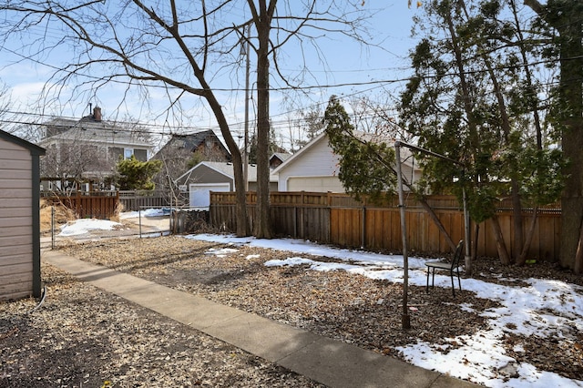 snowy yard with fence