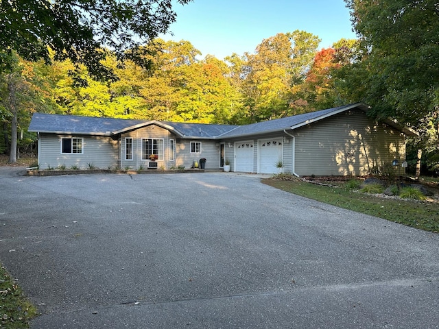 single story home with an attached garage and driveway