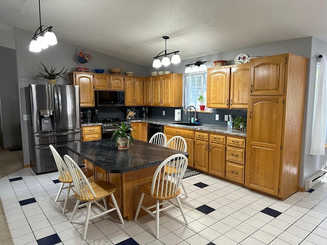 kitchen featuring a baseboard heating unit, a textured ceiling, a sink, and black appliances