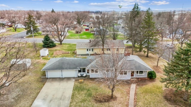 birds eye view of property with a residential view
