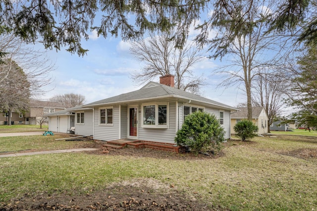 bungalow with a chimney, an attached garage, driveway, and a front yard