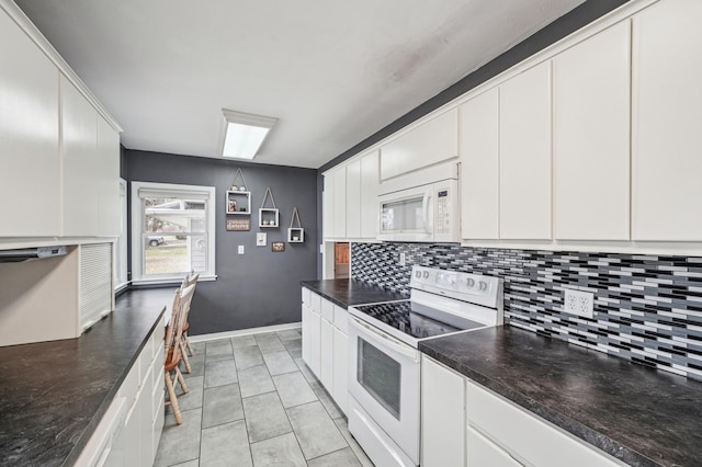 kitchen with white cabinetry, light tile patterned floors, decorative backsplash, and white appliances