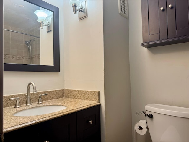bathroom with toilet and vanity