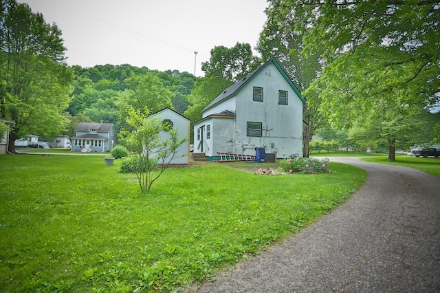 W340 State Road 29, Spring Valley, WI 54767 - view of side of home with a yard and stucco siding