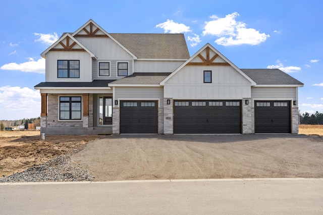 view of front of home featuring stone siding, board and batten siding, and dirt driveway