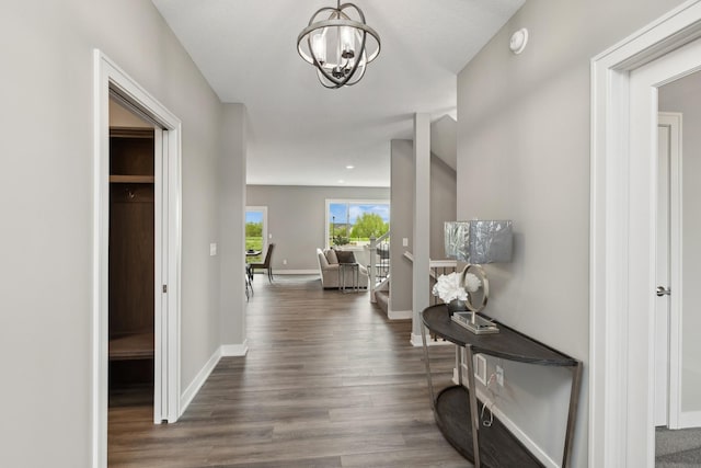 5323 177th St W, Lakeville, MN 55044 - corridor featuring a notable chandelier, baseboards, and wood finished floors