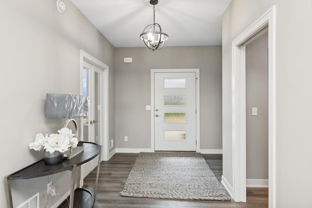 5323 177th St W, Lakeville, MN 55044 - entryway with visible vents, baseboards, a notable chandelier, and dark wood-style floors