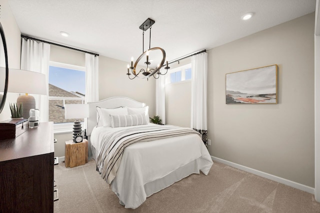 19321 Colonial Trl, Farmington, MN 55024 - bedroom with a chandelier, light colored carpet, baseboards, and recessed lighting