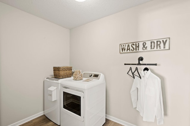 19321 Colonial Trl, Farmington, MN 55024 - laundry area with washer and dryer, wood finished floors, and baseboards