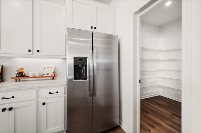 19321 Colonial Trl, Farmington, MN 55024 - kitchen with stainless steel fridge with ice dispenser, white cabinets, dark wood-type flooring, backsplash, and light stone counters
