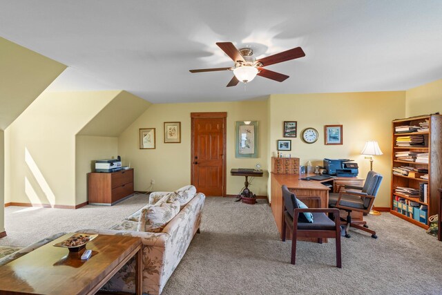 carpeted home office featuring baseboards and a ceiling fan