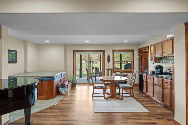 dining room featuring recessed lighting and wood finished floors