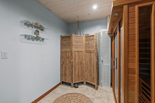 bathroom featuring baseboards and recessed lighting