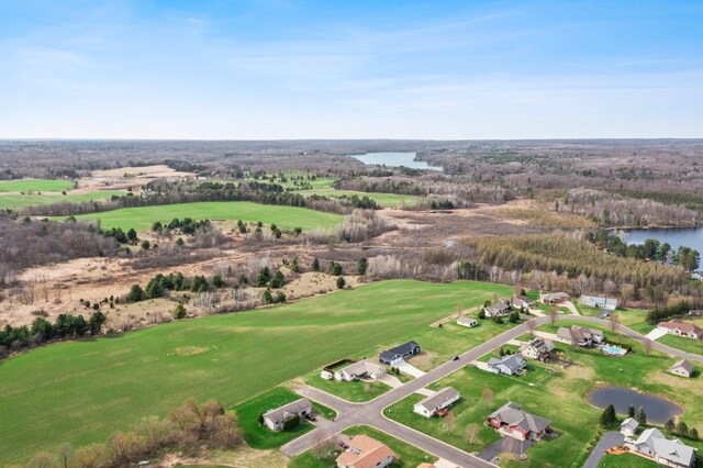 aerial view featuring a water view and golf course view