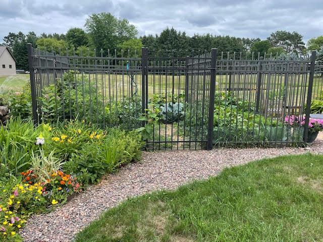 view of gate featuring fence