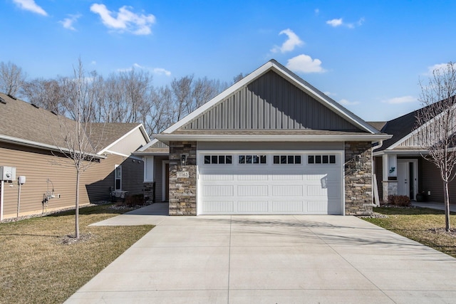 11163 184th Cir NW, Elk River, MN 55330 - craftsman house featuring a garage, concrete driveway, stone siding, board and batten siding, and a front yard