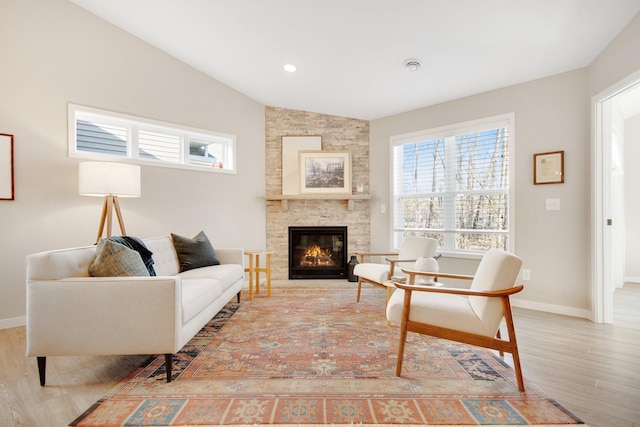 11163 184th Cir NW, Elk River, MN 55330 - sitting room with baseboards, lofted ceiling, wood finished floors, and a fireplace